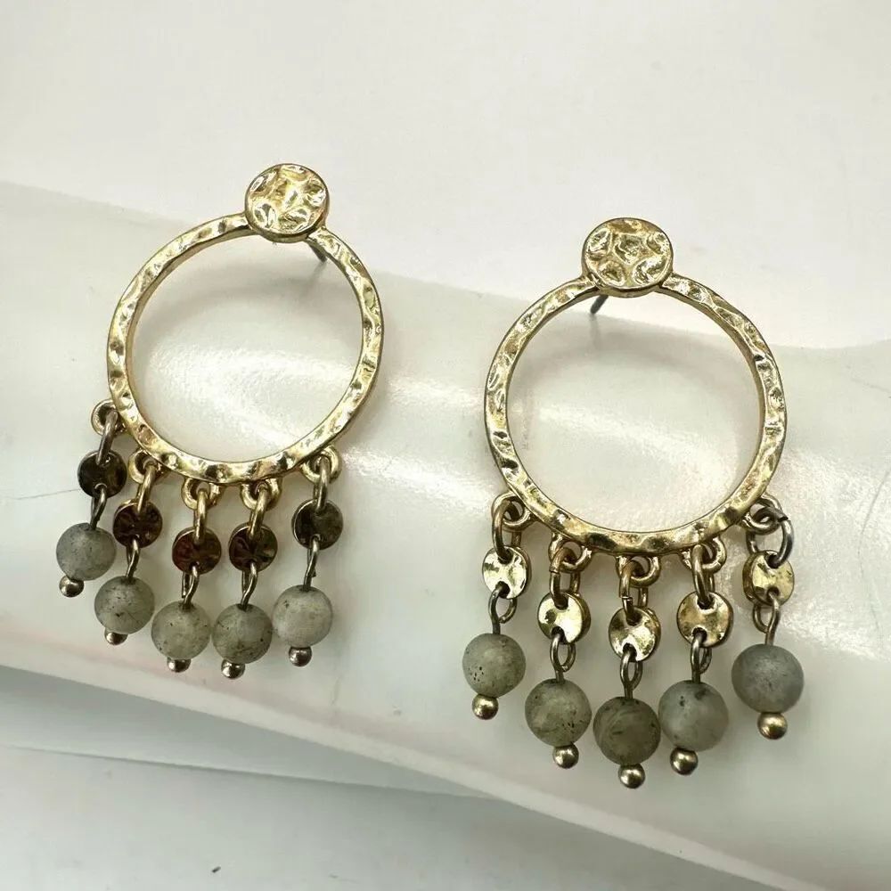 Gold tone green stones dangling earrings
